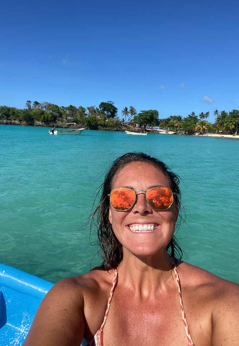 woman smiling on boat selfie